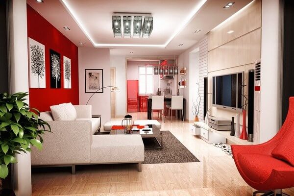 Sơn nhà rực rỡ và sáng rộng cho phòng khách với tông màu trắng chủ đạo kết hợp mảng tường đỏ tạo điểm nhấn rực rỡ cho căn phòng.