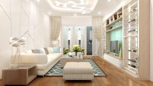 Phòng khách tông trắng kết hợp màu gỗ nhạt và mảng màu xanh tạo cảm giác thanh thoát, dịu nhẹ. Đèn trần trang trí cách điệu giúp điều tiết ánh sáng cho toàn bộ không gian, trong mẫu thiết kế nhà 4 tầng này.
