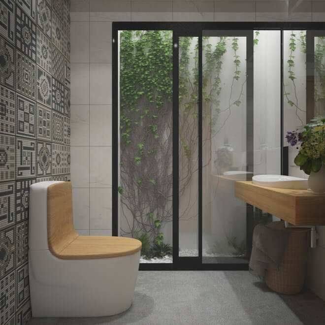 Tuy thiết kế đơn giản nhưng phòng vệ sinh có một khung cửa kính lớn kết nối với cây xanh ở phần thông tầng, ấn tượng trong mẫu thiết kế nhà đẹp