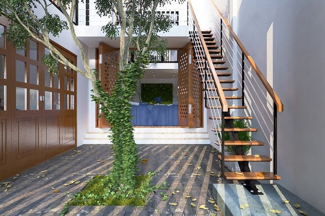  cầu thang ngoài trời dẫn trực tiếp lên phòng khách thứ 2. trong mẫu thiết kế nhà đẹp, đây cũng là nơi để gia đình thư giãn. Nhờ những mảng xanh bố trí khắp nơi nên việc đi lại giữa các không gian trong nhà không hề nhàm chán vì luôn thấy cây xanh.