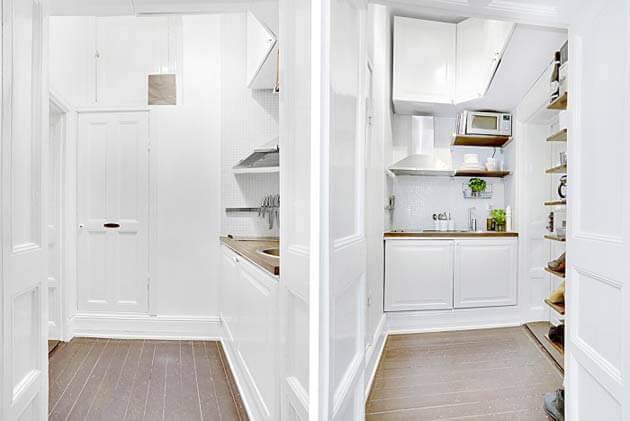 Không gian bếp trong mẫu thiết kế căn hộ này gọn gàng, sạch sẽ với máy hút mùi hiện đại, kích thước phù hợp.