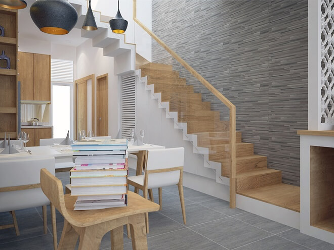 Để không gian sinh hoạt chung ở tầng 1 được rộng rãi, cầu thang được làm dọc nhà, trong mẫu thiết kế nhà ống 3 tầng này.