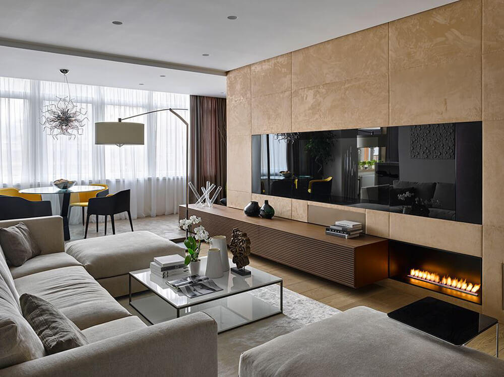 Thiết kế nhà 3 tầng, với phòng khách sử dụng bộ ghế sofa hiện đại, màu sắc trang nhã.